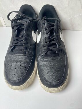 Nike Black Leather Sneakers with White Swoosh.